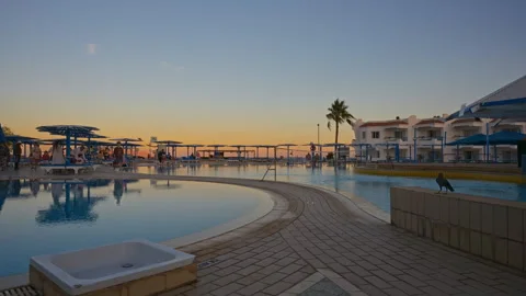 A Timelapse of swimming pool at a resort during sunset. Stock Footage 331201832