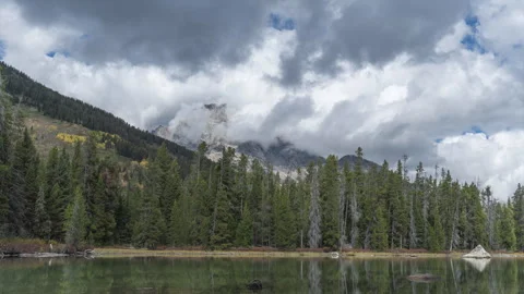 Timelapse of Swirling Clouds Dancing Over String Lake in Teton National Park Stock Footage 258194911