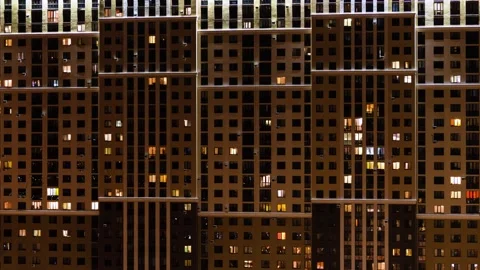 Timelapse of switching on and off lights in Windows of high-rise buildings at Stock Footage 135608711