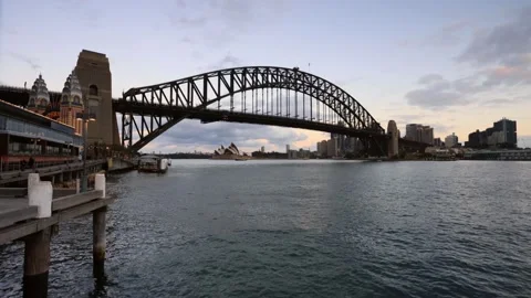 Timelapse of the Sydney Harbour bridge at sunset with bright lights and ferries. Stock Footage 135307432