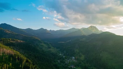 Timelapse of Tatra Mountains with Cable Railway and Lush Forest on a Partly Stock Footage 280441854