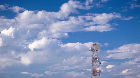 Timelapse of telecommunication tower against blue sky Stock Footage 101178957