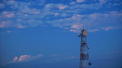 Timelapse of telecommunication tower against blue sky Stock Footage 101179048