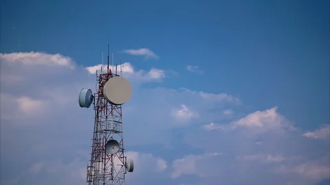 Timelapse of telecommunication tower against blue sky Stock Footage 101179160