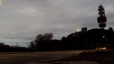 Timelapse - Telecomunication Tower with Vehicles moving at Night Stock Footage 87501374
