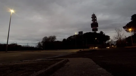 Timelapse - Telecomunication Tower with Vehicles moving at Night Stock Footage 87501468
