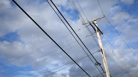 Timelapse of telephone pole electrical lines over sky background Stock Footage 106424369