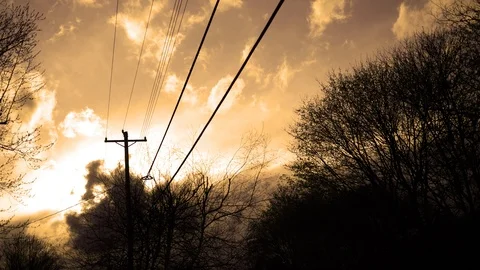 Timelapse of telephone pole electrical lines over sky background - evening solar Stock Footage 106424466