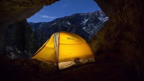 Timelapse of tent lit up in cave Stock Footage 84287884