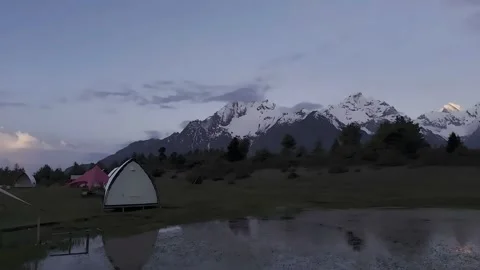 Timelapse of Tents Reflected in Lake with Snow-capped Mountains in Tibet Видео 336825825