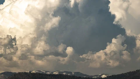 Timelapse of Thunderhead above Snow Covered Mountains. Stock Footage 278226963