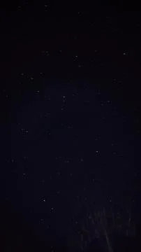 Timelapse, time lapse Deep dark night sky filled with distant shining stars.. 스톡 사진