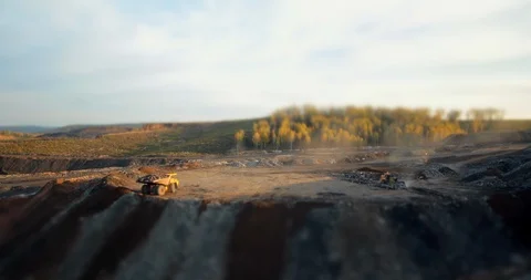 Timelapse time-lapse dump trucks spill out an earth and a stones Stock Footage
