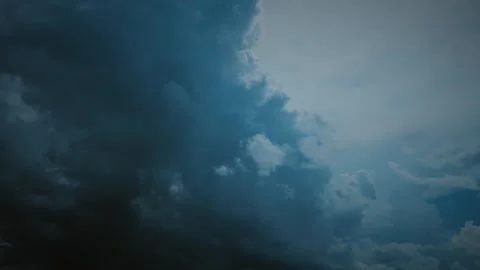 Timelapse, time lapse Intense dark storm clouds with hints of light breaking Stock Footage 341374454
