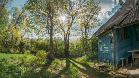 Timelapse, time lapse, Old blue wooden house in a bright spring garden Stock Footage 341381759