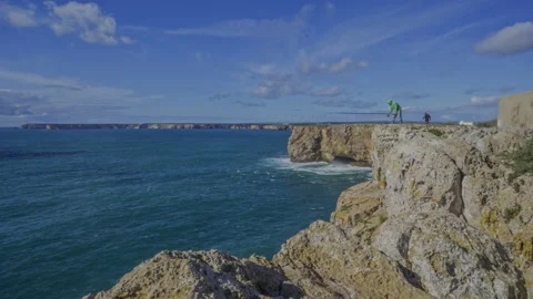 Timelapse on top of a cliff with fishermen Stock Footage