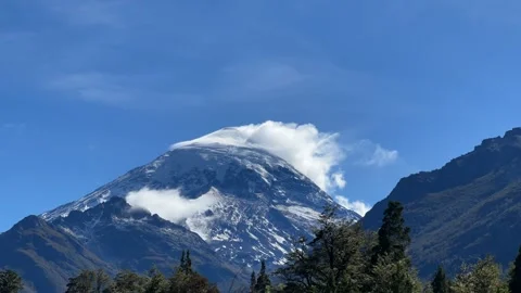 Timelapse of the top of Lanin volcano with lenticular clouds circling Stock Footage 271379351