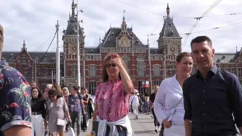 Timelapse of tourists exiting Amsterdam Central Station Stock Footage 113563780