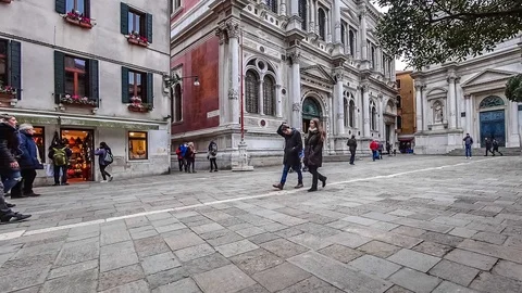 Timelapse of tourists in a narrow passage between old brick buildings in Venice Stock Footage 89149628