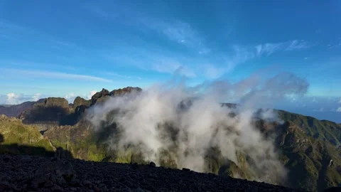 Timelapse of Towering Peaks and Rolling Clouds Along the PR1 Vereda do Areeiro Stock Footage 303954846