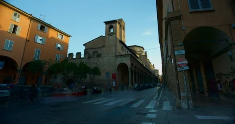 Timelapse of traffic and everyday life on streets of Bologna at sunset, Italy Stock Footage 99103161