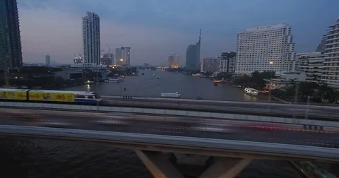 Timelapse of Traffic and Skytrain, Bangkok River Bridge, Slider Shot Stock Footage 75305953