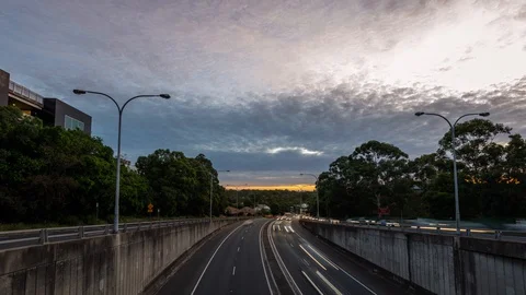 Timelapse of traffic and sunset clouds at dusk down Ryde Road, Pymble Stock Footage 129002833