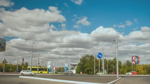 Timelapse. Traffic on the background of a blue sky with white clouds. Stock Footage 160457355