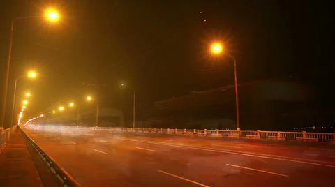 Timelapse of traffic on bridge at night. Blurred motion 库存影片 29457567