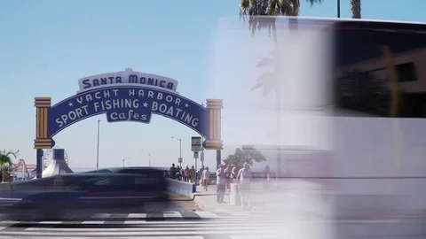 Timelapse of traffic in front of santa monica pier sign Stock Footage 84165920