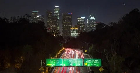 Timelapse  of traffic going into Downtown Los Angeles as the camera tilts up Stock Footage 72556550