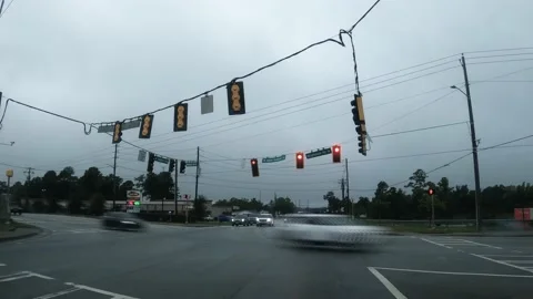 Timelapse traffic at an intersection with storm clouds dash cam view Harlem G Stock Footage 201122414