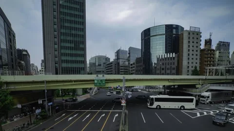 A timelapse of traffic jam at the city crossing in Tokyo wide shot panning Stock Footage 314241743