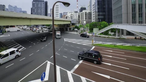 A timelapse of traffic jam at the city crossing in Tokyo wide shot panning Stock Footage 314242007