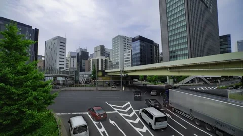 A timelapse of traffic jam at the city crossing in Tokyo wide shot tilt Stock Footage 314242122