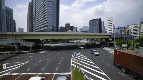 A timelapse of traffic jam at the city crossing in Tokyo wide shot tilt Stock Footage 314242281