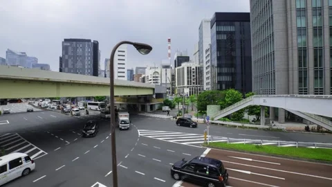 A timelapse of traffic jam at the city crossing in Tokyo wide shot zoom Stock Footage 314242296