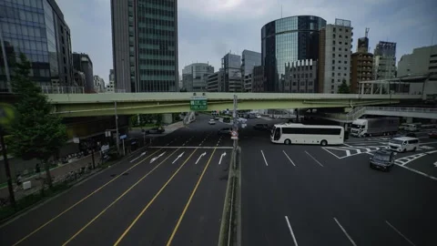 A timelapse of traffic jam at the city crossing in Tokyo wide shot tilt Stock Footage 314242313