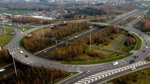 A timelapse of traffic moving around roundabout in rush hour Stock Footage 149624526