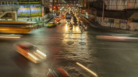 Timelapse of traffic at night at the Bangkok intersection Stock Footage 124398900