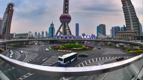 Timelapse of traffic in Shanghai on roundabout - moving cars and clouds Stock Footage 203962753
