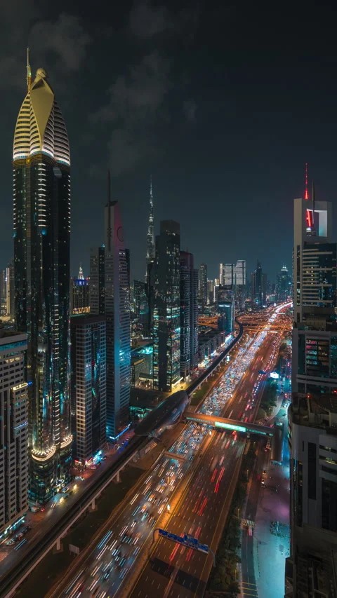 Timelapse of Traffic on Sheikh Zayed Road at Night in Dubai, UAE, Zoom Out Stock Footage 286154849