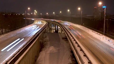 Timelapse of traffic on snow-covered freeway road Stock Footage 87755225