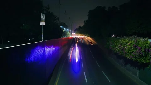Timelapse of traffic with trees around the road Stock Footage 249322940