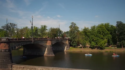 Timelapse of Trams and Traffic Passing over Legii Bridge with Paddle Boats Stock Footage 93111637