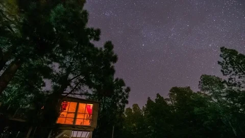 Timelapse tree house night sky stars trails Stock Footage 101050123
