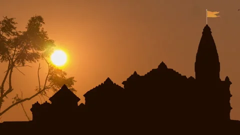 TimeLapse of Trees Swaying as Sun Rises Behind Ayodhya's Ram Mandir, India. Stock Footage 262437008
