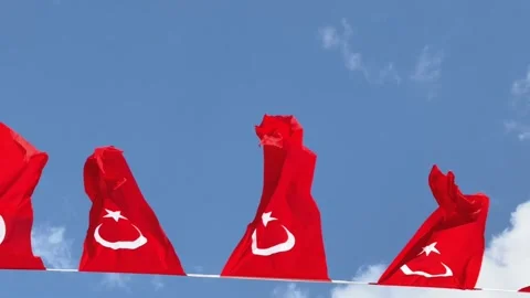 Timelapse of Turkish national flags waving in the wind against cloudy blue sky Stock-Footage 326089628