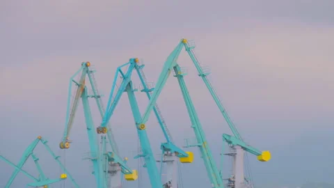 Timelapse: turquoise harbor cranes during work against sky in the port Stock Footage 335051520