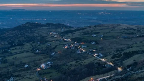 Timelapse Twilight falling over Dinorwig village and Anglesey beyond Stock Footage